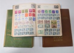 Three 20th century stamp albums containing antique and later British stamps and stamps of the world