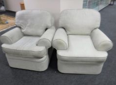 A pair of Marks & Spencers armchairs upholstered in a beige fabric