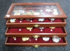 A contemporary counter top pocket watch display cabinet containing pocket watches