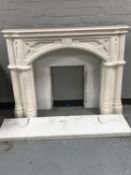 A classical composite fire place together with marble hearth and back