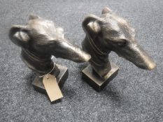 A pair of cast metal grey hound heads