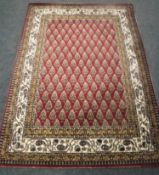 An Eastern style machine made rug,