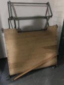 A mid 20th century drawing board on metal stand