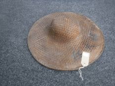 A vintage Chinese wicker hat