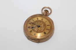 A 9ct gold fob watch with engraved foliate decoration CONDITION REPORT: 26.