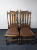 A set of four Edwardian oak dining chairs