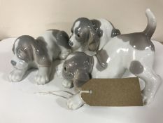 Three Lladro figures of puppies