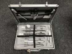 An aluminium brief case containing a chef's knife set by Schiller