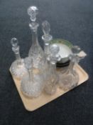 A tray containing six antique glass decanters with stoppers together with a glass vase,
