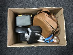 A box of assorted cameras including Bells & Howell cine camera, Canon camera,