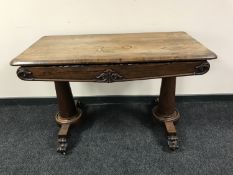 A Regency rosewood twin pedestal library table fitted a drawer