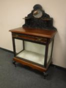 A Victorian mahogany mirrored-back display case fitted a drawer,