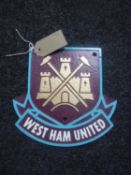 A cast metal plaque "West Ham"