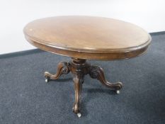 An early Victorian mahogany oval tilt topped breakfast table