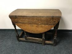 A 19th century oak gate leg table
