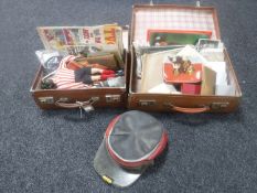 Two vintage leather cases containing vintage hat, football cards, ephemera,