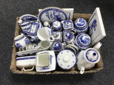 A box containing a large quantity of Ringtons willow tree pattern china and place mats