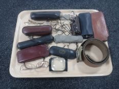 A tray containing antique and later glasses, magnifying lens,