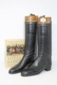 A pair of 19th century black leather military boots with trees,