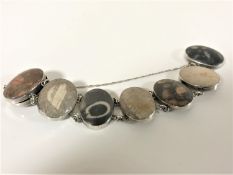 An early 20th century white metal mounted panel bracelet