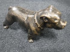 A cast metal figure of a pit bull