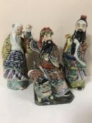 Three early 20th century Chinese ceramic figures of warriors and elderly men