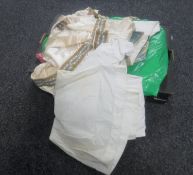 A box containing vintage clothing, ceremonial clothes,