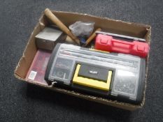 A box of plastic storage boxes containing hardware, cased drill bits,