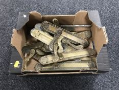 A box of antique brass door handles
