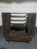 An antique cast iron fire front with grate