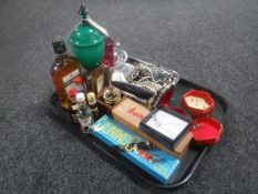 A tray of assorted costume jewellery, dominoes, boxed Captain Cook magnifier,
