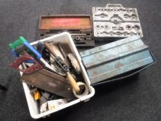 A plastic crate and tool box of vintage hand tools and saws,