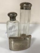 A Georgian curved silver snuff box and two silver-topped dressing table bottles