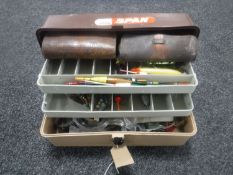 A fishing box containing a quantity of accessories together with two leather pouches containing