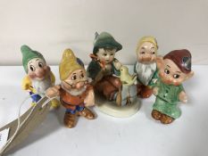 Four German Walt Disney figures; Dopey, Doc, Sleepy and Bashful,