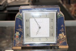 A Japanned eight day mantel clock by The Northern Goldsmiths Company