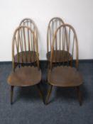 A set of four Ercol high backed dining chairs