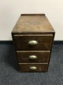 A narrow three drawer chest and a walnut Art Deco standard lamp