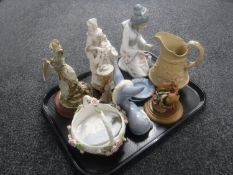 A tray containing assorted figurines, Spanish figure of a geisha,