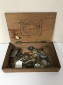 A box of military badges, enamelled buttons,