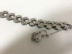 A 19th century white metal cuff bracelet with safety clasp