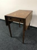 A Victorian oak flap sided table fitted a drawer