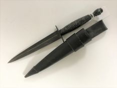 A mid 20th century Fairbairn Sykes type dagger in scabbard,