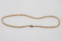 A strap of cultured pearls on 9ct gold clasp,
