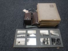 A tray of vintage cameras, ledger,