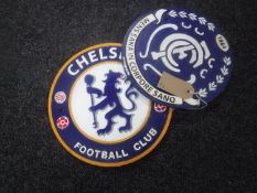 Two cast metal football plaques