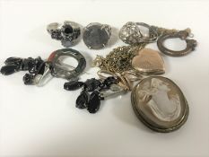 A collection of antique and later jewellery including dress rings, cameo brooch, heart pendant,
