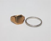 A 9ct gold signet ring and a band ring stamped 'PLAT' CONDITION REPORT: Signet ring