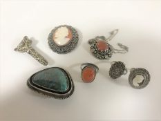 A small collection of white metal jewellery to include marquisette rings, brooches,