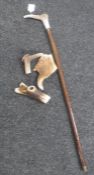 An antler handled walking stick and three further pieces of antler